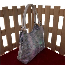 Роскошная сумка Parallel из натуральной кожи с лазерной обработкой бледно-пурпурного цвета с переливами.